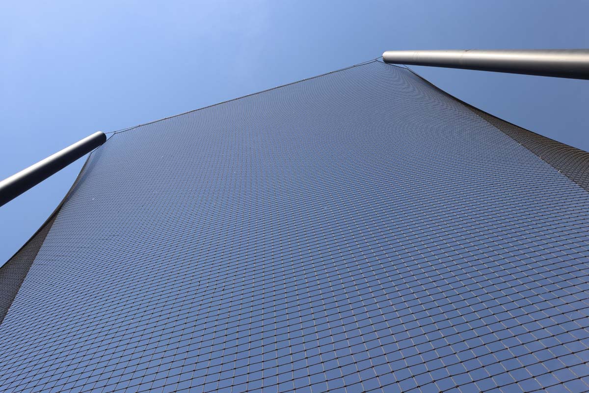 Custom netting installation for sports arena