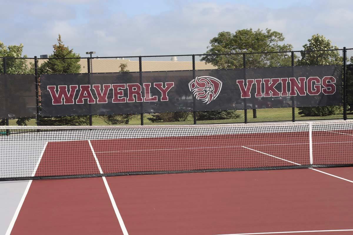 Tennis court fence with windscreen and custom graphic