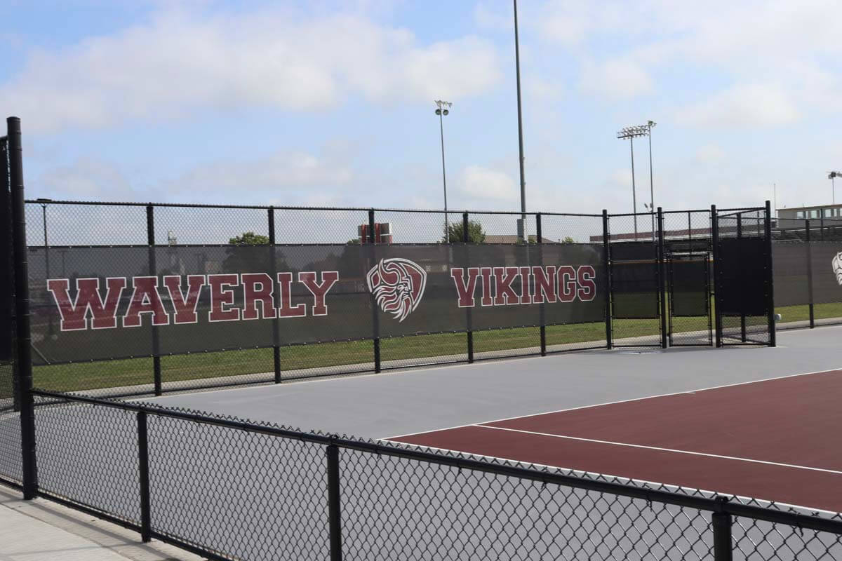 Sports graphic on black chain link fence