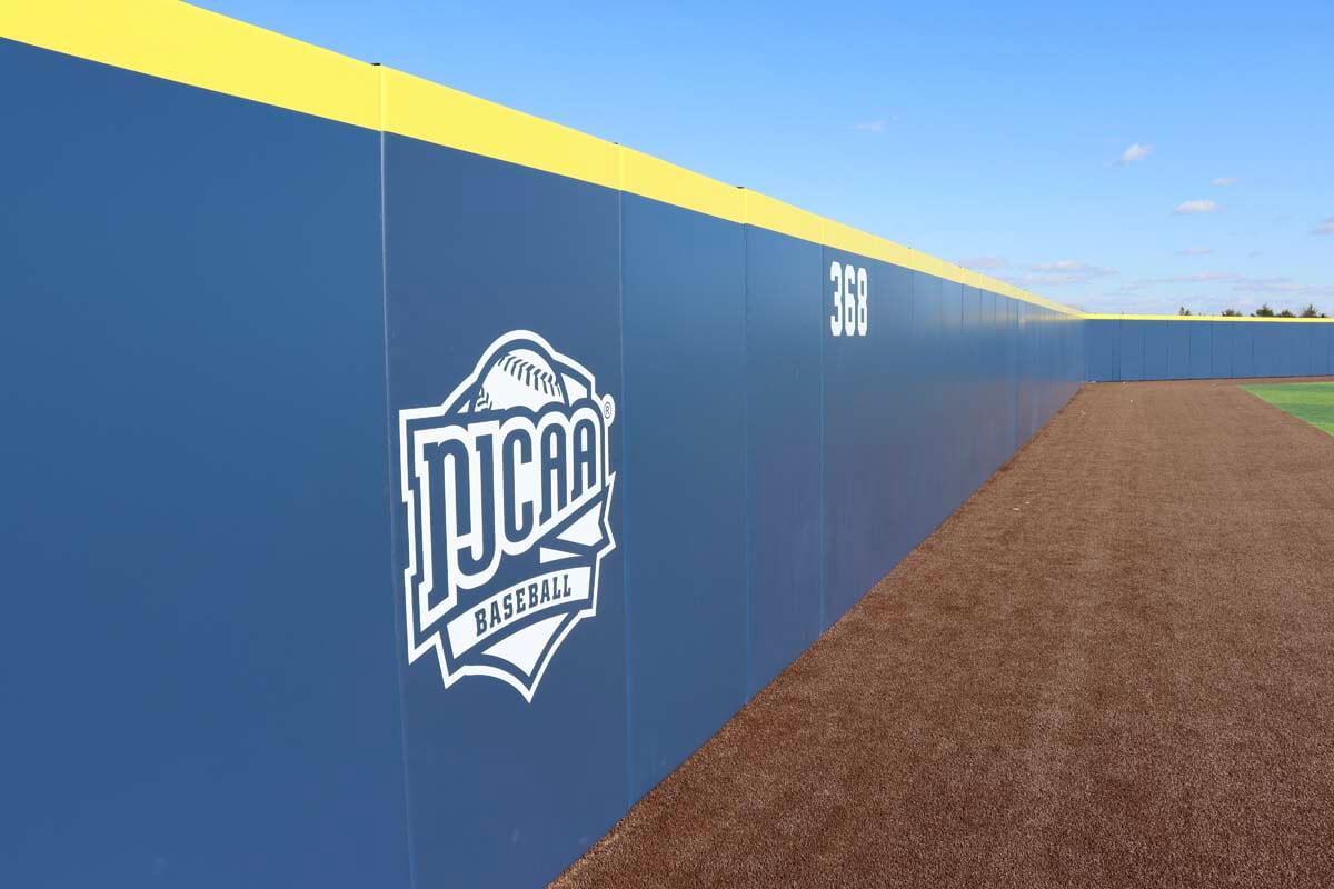 Impact wall padding for sport fields with custom graphic